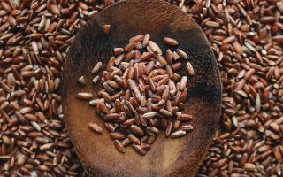 Close-Up Photo Of Brown Rice On Wooden Spoon